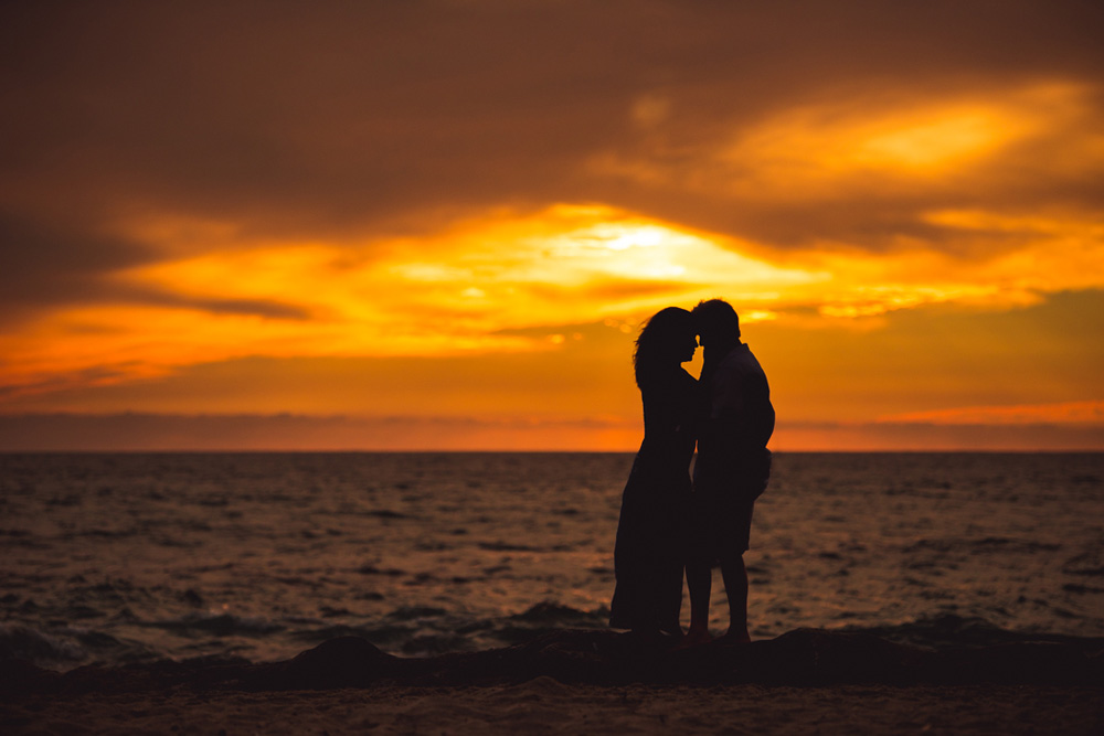 sunset silhouette with loving couple