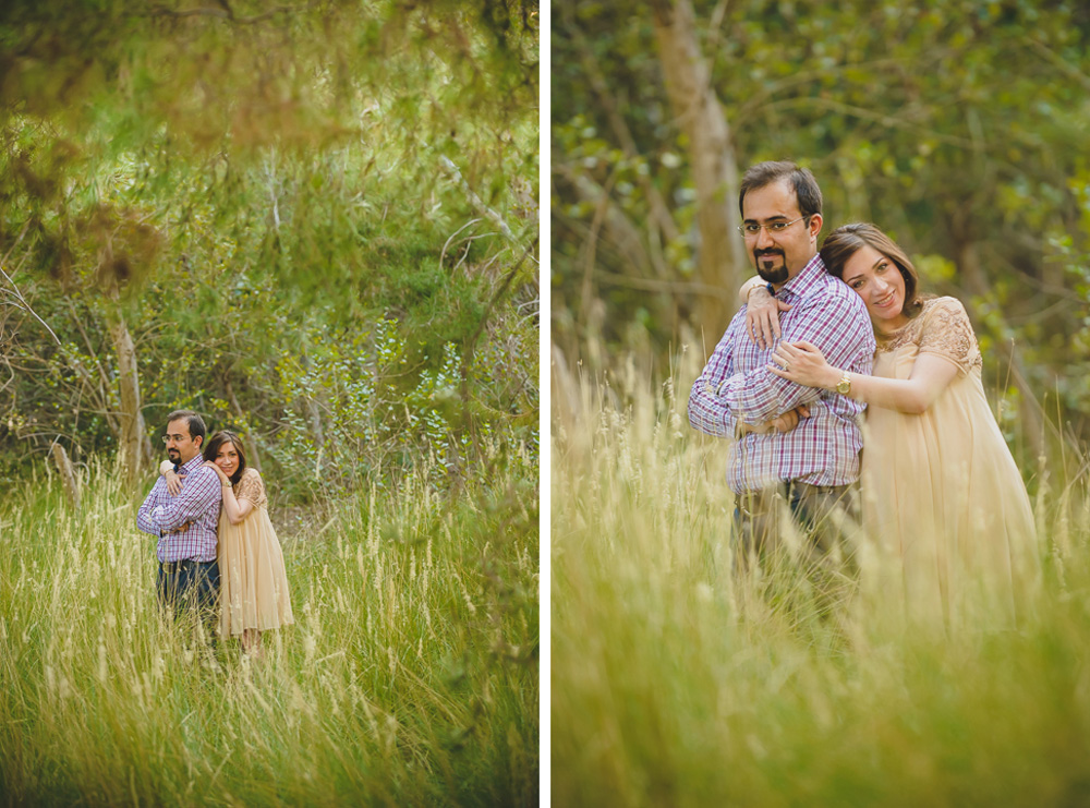 wife hugging her husband in a park