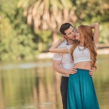 loving engaged couple at the lake side