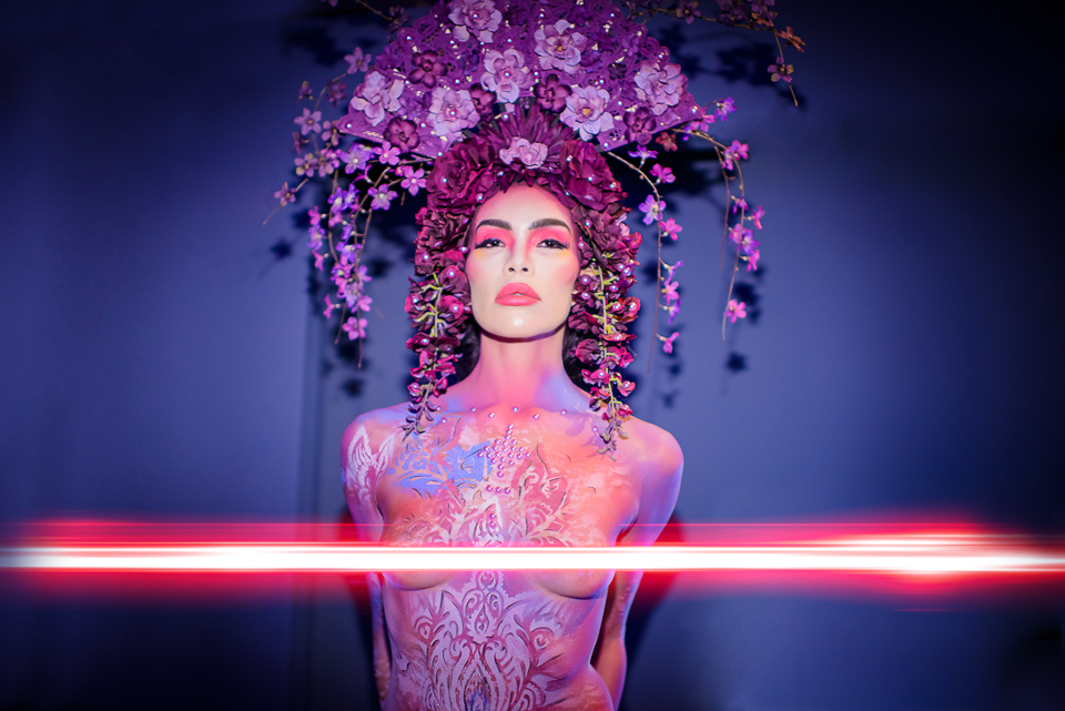 model wearing amazing headpiece, bodypainting